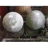 Pair of cast concrete spherical column finials