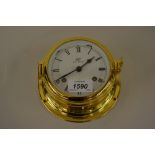 Modern gilt brass cased ships bulk head clock by Schatz,