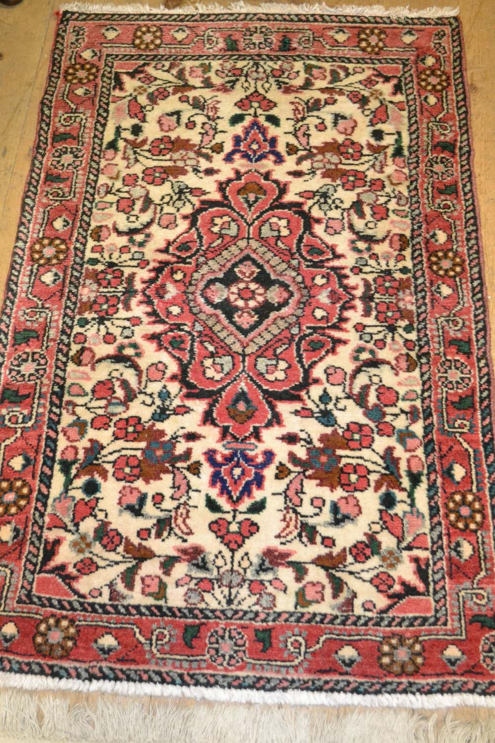 Small Persian style rug having central medallion with all-over floral decoration and multiple