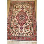 Small Persian style rug having central medallion with all-over floral decoration and multiple