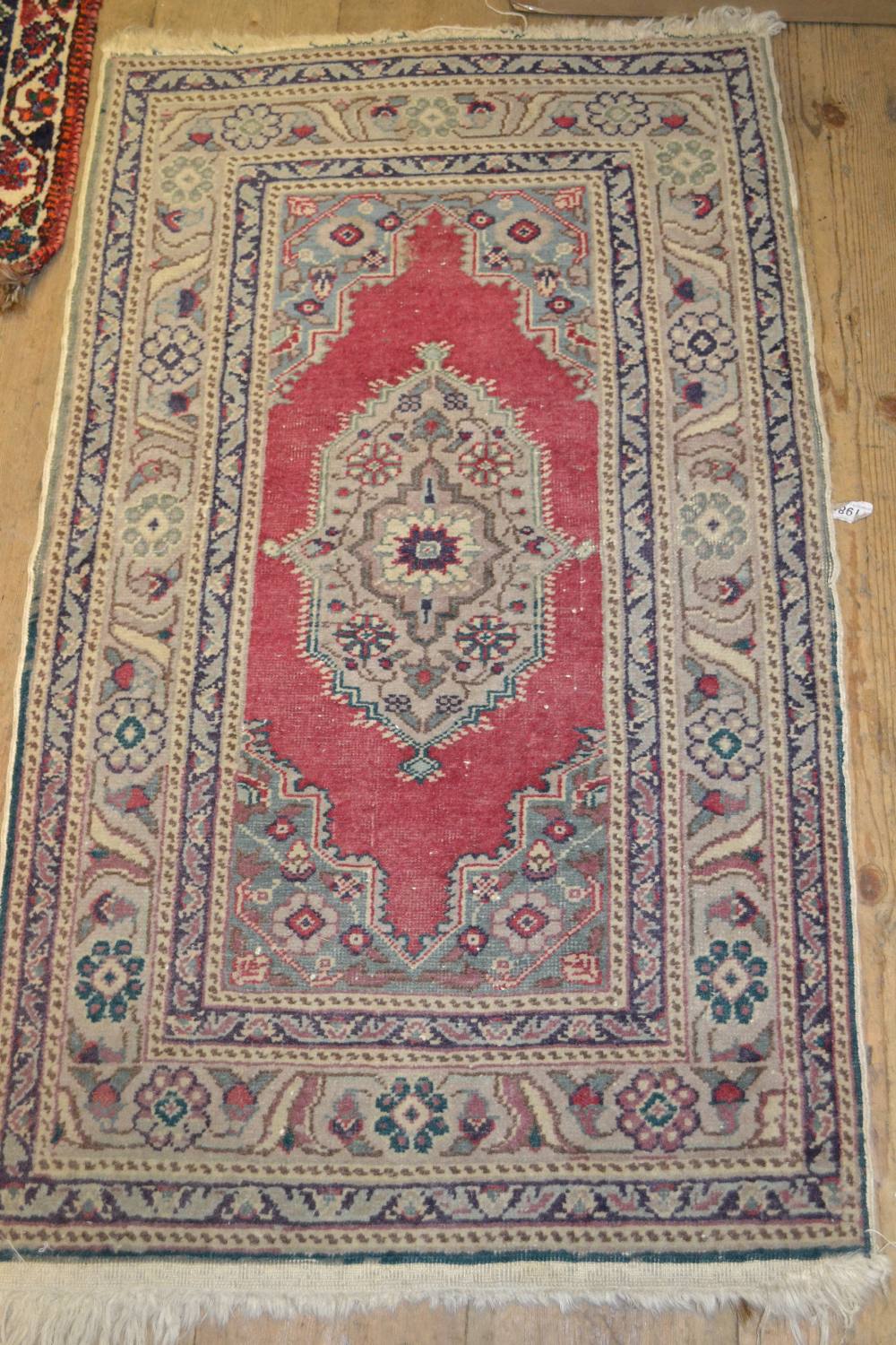 Small Persian pattern rug with centre medallion and multiple borders,