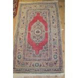 Small Persian pattern rug with centre medallion and multiple borders,