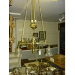 Edwardian brass rise and fall light fitting with frosted wrythen glass shades