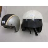 1950's Motor cycle helmet together with another similar later helmet