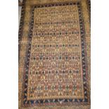 Small Caucasian rug having all-over stylised floral design with multiple borders on a beige ground,