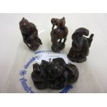 Four various carved wooden netsuke
