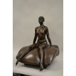 Lloyd Glasson, Limited Edition dark patinated bronze figure of a seated girl nude on a cushion,