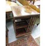 Good quality Edwardian mahogany and marquetry inlaid revolving bookcase with slatted sides on a