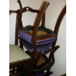 Set of six Victorian rosewood balloon back dining chairs with overstuffed seats raised on cabriole