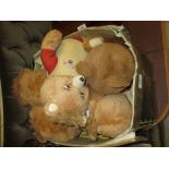 Box containing a quantity of various Teddy Ruxpin soft toys, videos, booklets etc.
