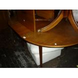 Mid 20th Century teak circular extending dining table by McIntosh, Kirkaldy,