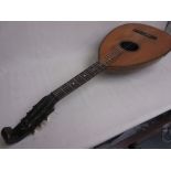 Guitar lute with ovoid faceted body and ebonised neck