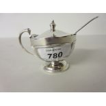 Birmingham silver circular pedestal mustard with associated spoon (lacking liner)