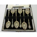 Cased set of six Continental silver gilt enamel decorated coffee spoons