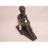 Bronzed composition figure of a seated nude