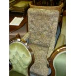 19th Century mahogany open arm library chair having button upholstered back,