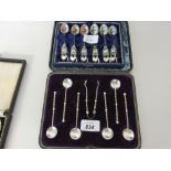 Cased set of six 19th Century South African spoons and tongs with coin bowls together with a cased