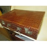 Embossed leather simulated crocodile skin suitcase