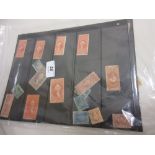 Two loose leaves containing a collection of United States inland exchange revenue stamps including