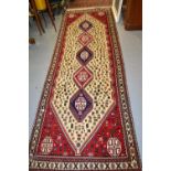 South West Persian runner with five centre medallions and all-over bird and floral design with