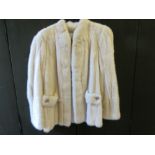 Ladies pale fur jacket labelled Monte Carlo