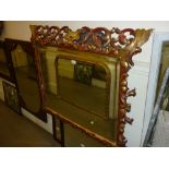 Late 19th or early 20th Century Florentine red painted and parcel gilt cushion framed wall mirror