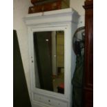 19th Century French single door armoire having moulded cornice with mirrored door above two drawers