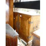 18th Century Continental cabinet on stand having two flush panelled doors enclosing a fitted