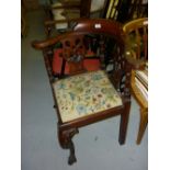 Late 19th Century mahogany corner chair having pierced carved and turned back supports with drop-in