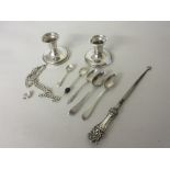 Pair of Birks sterling silver dwarf candlesticks, five various spoons, silver handled button hook,