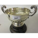 Chester silver two handled pedestal trophy cup on an ebonised base