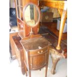 Edwardian mahogany bow fronted washstand having oval mirrored back above a single drawer and