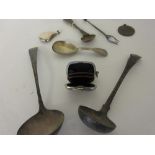 Small silver purse, two Scottish silver sauce ladles,