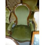 Victorian carved walnut open armchair raised on cabriole supports