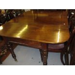 Large Victorian mahogany extending dining table raised on turned tapering supports with brass