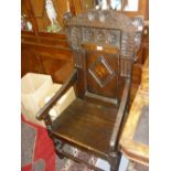 17th Century oak Wainscot type elbow chair, the carved and inlaid back above shaped arms,