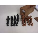 Wooden box containing a natural and ebonised boxwood chess set, height of King, 3.