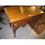 18th Century oak lowboy with a moulded top above three drawers raised on turned supports