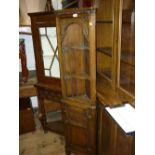 Good quality narrow reproduction oak floor standing corner cabinet having open shelf top above a