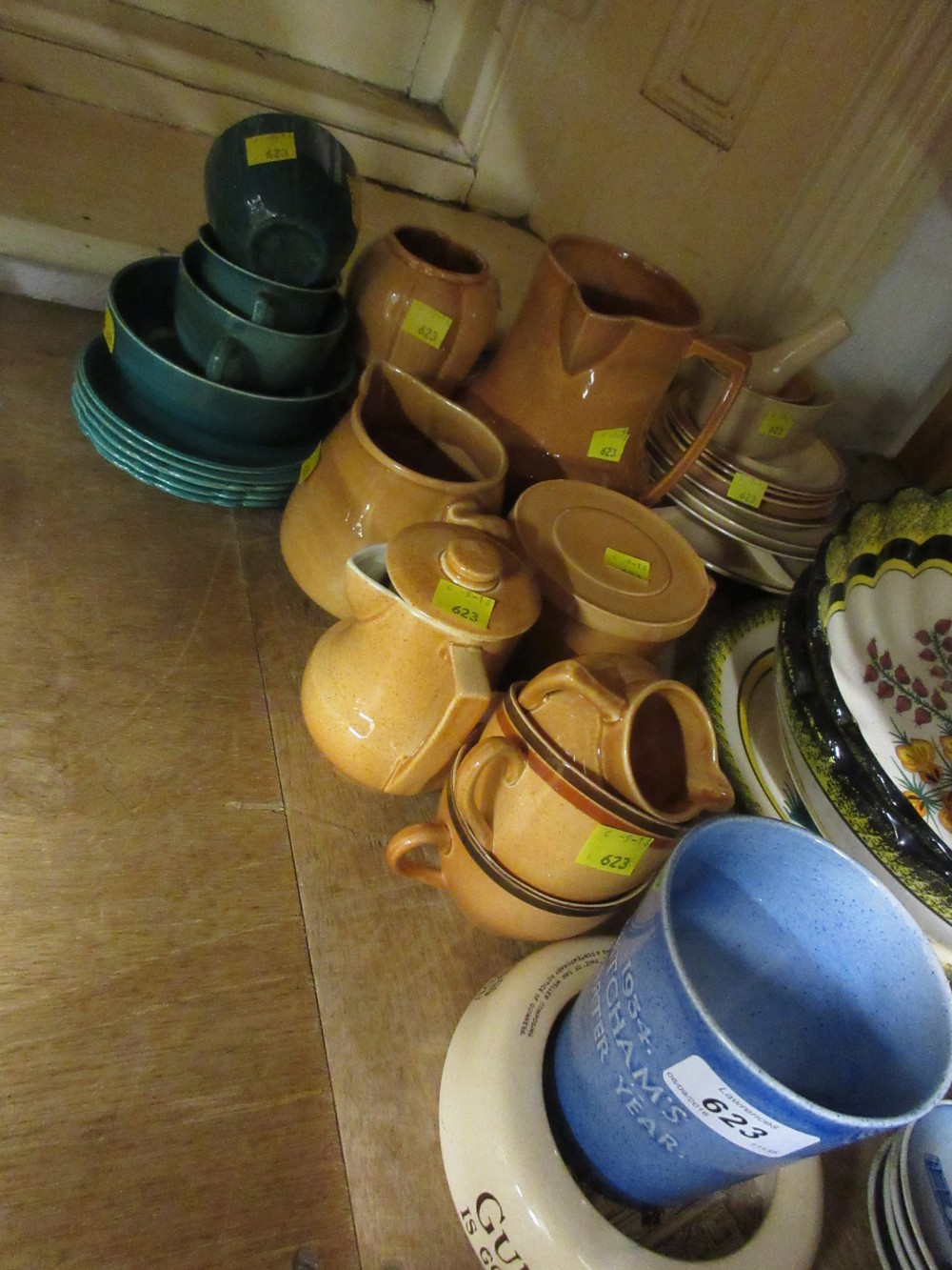Collection of various Ashtead pottery items including a Guinness ashtray and a Mitchams