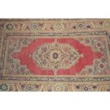 Small Persian pattern rug with centre medallion and multiple borders,