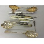 Two Georgian silver gilt berry spoons, silver handled shoe horn, small silver handled button hook,