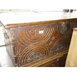 17th Century oak plank coffer with later all-over carving