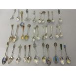 Loose quantity of various English and Continental silver and plated enamel decorated spoons