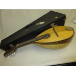 Tatra eight string mandolin in a fitted case