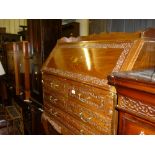 Mid 20th Century oriental hardwood and brass inlaid bureau with fall front above four short drawers