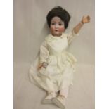 Kammer and Rheinhart bisque headed doll having sleeping eyes with fully jointed body,