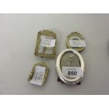 Three various small photograph frames with bow surmounts,