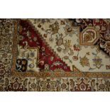 Machine made Heriz rug on beige ground, 1.9m x 1.