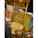 19th Century fruitwood rocking chair with ladder back above a rush seat